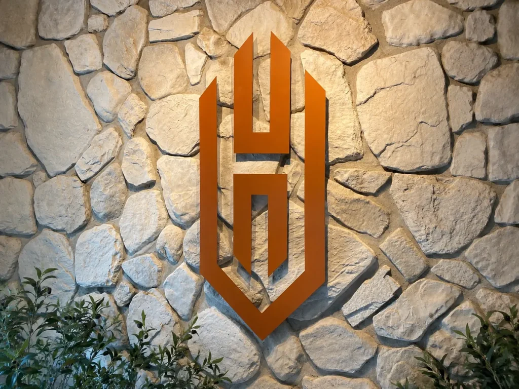 freeslogo op steenwand the high value club reusel